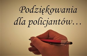 Napis podziękowania dla policjantów ręka trzymająca długopis