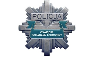 Na zdjęciu logo policji w Oświęcimiu. Gwiazda z napisem Policja Oświęcim Pomagamy i Chronimy